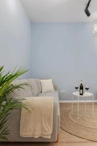 a living room with a couch and a table at VD Boutique Apartments No 3 in Bucharest