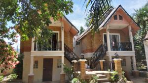 a house with stairs leading up to it at Wilai Villa Lamai in Lamai