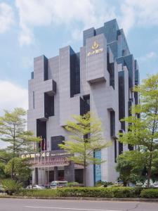 a building with a sign on the side of it at Shenzhen Avant-Garde Hotel in Bao'an