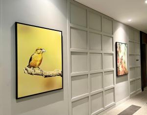 a painting of a bird on a branch on a wall at Le Vert Boutique Hotel in Genting Highlands