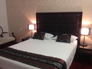 Postel nebo postele na pokoji v ubytování Hotel Vip Grand Maputo