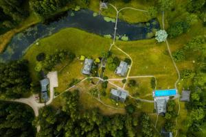 an overhead view of a park with houses and a road at Mini hotel in Kuldīga