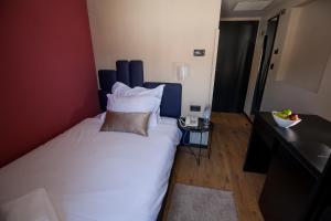Postel nebo postele na pokoji v ubytování Boutique Hotel Bura 45N