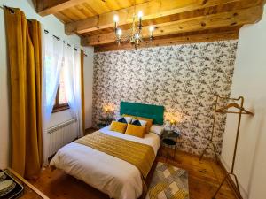 Postel nebo postele na pokoji v ubytování El Molino de la Ropería