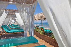 a view of the beach from the balcony of a beach house at Larissa in Skala