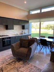 a kitchen and living room with a couch and a table at Highgrange Apartments in Dundalk