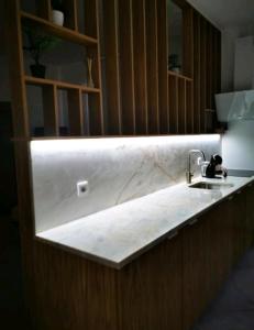a kitchen with a sink and a counter top at Isabel do Couto - casa de charme in Castro Daire