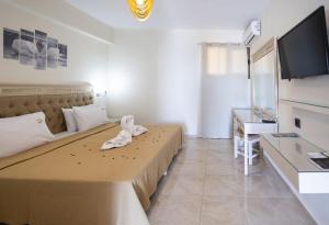 Postel nebo postele na pokoji v ubytování FabView Studio Apartments