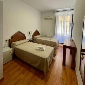 Postel nebo postele na pokoji v ubytování Arteaga Hostal & Baños Arabes Elvira