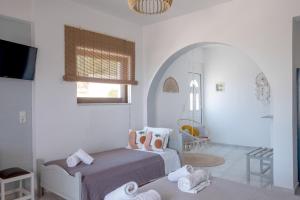Voodi või voodid majutusasutuse Pefkides Aegina Boutique Apartments toas