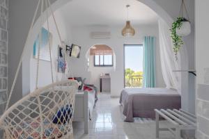 Voodi või voodid majutusasutuse Pefkides Aegina Boutique Apartments toas
