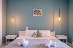 Voodi või voodid majutusasutuse Pefkides Aegina Boutique Apartments toas