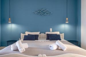 Voodi või voodid majutusasutuse Pefkides Aegina Boutique Apartments toas