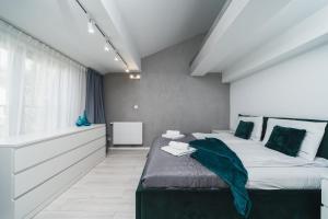 Łóżko lub łóżka w pokoju w obiekcie Ice Apartments