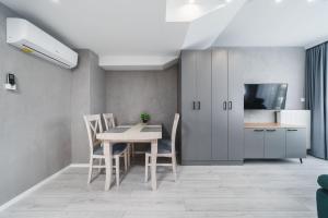 Telewizja i/lub zestaw kina domowego w obiekcie Ice Apartments
