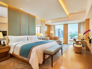 Postel nebo postele na pokoji v ubytování Pan Pacific Beijing