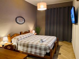 Ένα ή περισσότερα κρεβάτια σε δωμάτιο στο HOTEL LE FONTI