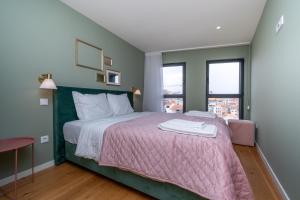 Ένα ή περισσότερα κρεβάτια σε δωμάτιο στο Trindade Duplex by Amber Star Rent