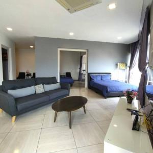 a living room with a couch and a bed at Octagon Premium Ipoh Town Center 2BR 101 by Grab A Stay in Ipoh +22 photos
