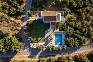 an aerial view of a house with a swimming pool at Villas Almyrida in Almyrida