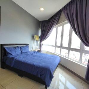 Giường trong phòng chung tại Octagon Premium Ipoh Town Center 2BR 101 by Grab A Stay