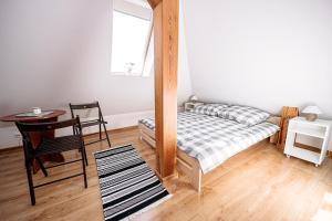 Posteľ alebo postele v izbe v ubytovaní Apartament Pastorówka