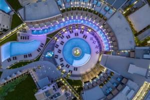 an overhead view of a round building with a pool at Nautilux Rethymno by Mage Hotels in Rethymno Town