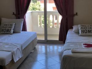 Postel nebo postele na pokoji v ubytování Relax Apartment & Hotel
