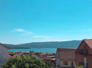 a view of a city with a body of water at Apartmani Cupara in Tivat
