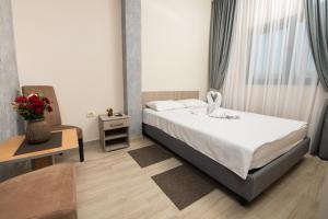 Postel nebo postele na pokoji v ubytování IPN ROOMs