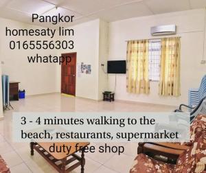 a living room with a couch and a room with at Pangkor Homestay in Pangkor