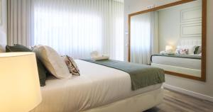 Tempat tidur dalam kamar di Hotel Campo do Rosmaninho