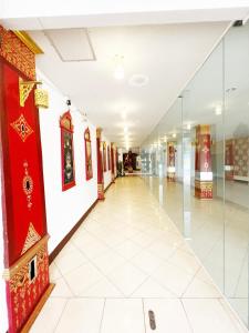 a hallway of a building with red and white walls at Silver Resortel in Patong Beach