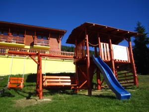 a playground with a slide and a slideintend at Penzión pod Barancom in Žiar