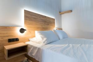 Voodi või voodid majutusasutuse Jacuzzi suite Piazza dei Leoni toas