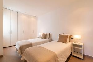 Postel nebo postele na pokoji v ubytování LUXURY HOLIDAYS SUITES, Playa de los Cristianos