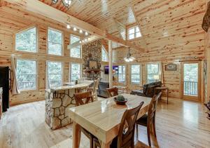 a dining room with a table and chairs in a cabin at Private Luxury Cabin w Pool Table and Firepit in Cornelia