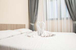 Postel nebo postele na pokoji v ubytování IPN ROOMs