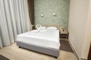 Postel nebo postele na pokoji v ubytování IPN ROOMs