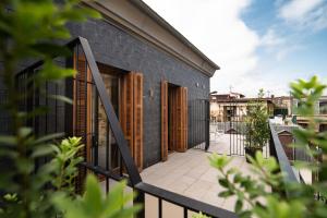 a balcony with wooden shutters on a building at Hotel Atari in Donostia-San Sebastián