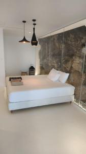 Un pat sau paturi într-o cameră la Ria Mar Lion