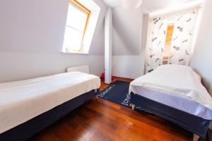 Posteľ alebo postele v izbe v ubytovaní Apartament Centrum Mostowa