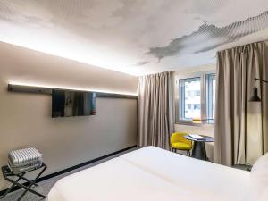 Un ou plusieurs lits dans un hébergement de l'établissement Hotel ibis Lisboa Saldanha