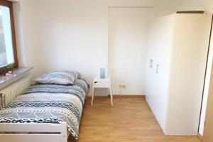 Postel nebo postele na pokoji v ubytování Ferienwohnung mit fantastischem Ausblick & SmartTv