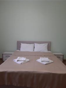Una cama o camas en una habitación de Готель Баронський Двір