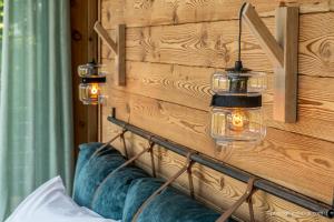 Voodi või voodid majutusasutuse Les chalets d'Éléna toas