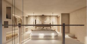 sypialnia z łóżkiem ze szklaną ścianą w obiekcie Ria Mar Suites w mieście Mykonos