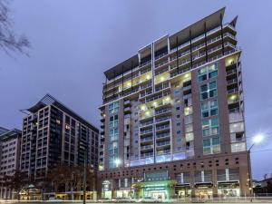 a large building with lights in front of it at 96 North Terrace Spa Apartment in Adelaide