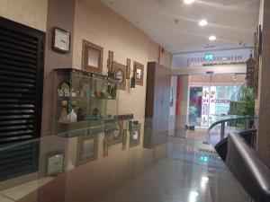 a lobby with a display case in a building at Horizon Hotel Apartments in Dubai