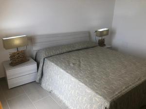 Una cama o camas en una habitación de Le 5 Residence